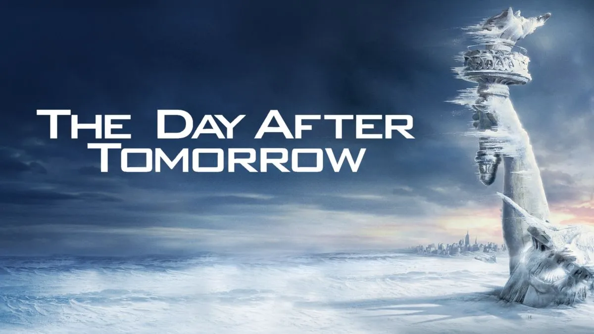 The movie poster for The Day After Tomorrow - shows the statue of liberty frozen and buried in snow.