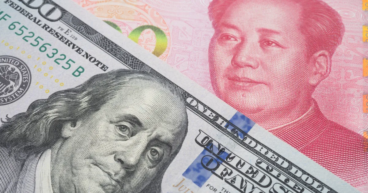 US dollar next to Chinese Renminbi.
