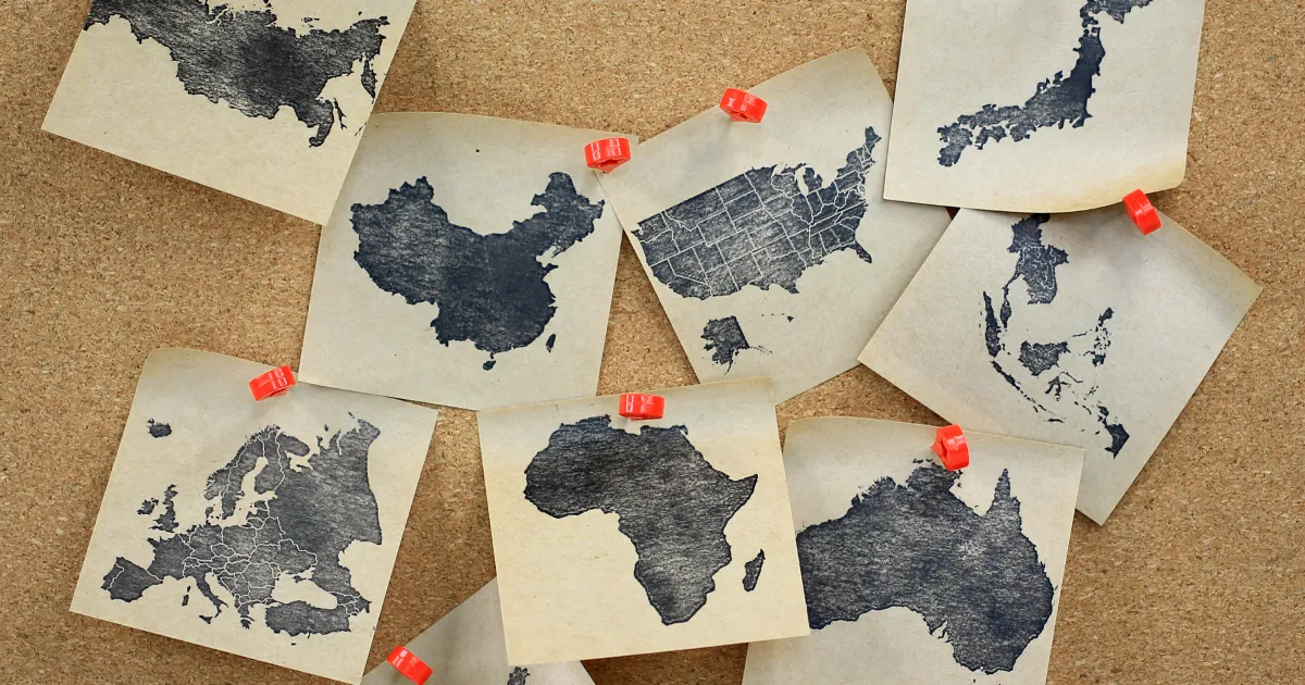 A corkboard showing areas of the world that are at risk for geopolitical supply chain risks.